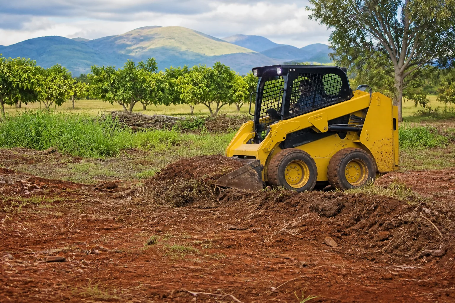 Illustrative compact skid steer moving dirt